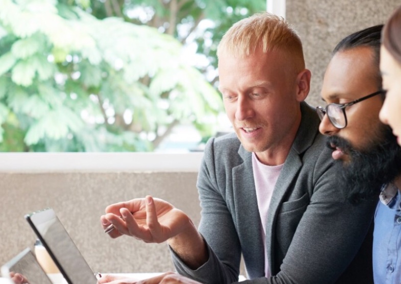 Employees brainstorming ideas to create a customer-centric approach in their business.